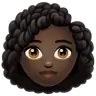 Woman: Dark Skin Tone, Curly Hair Emoji 👩🏿‍🦱 image - WhatsApp style