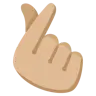 Hand With Index Finger And Thumb Crossed: Medium-Light Skin Tone Emoji 🫰🏼 image - Google Noto Color style