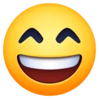 Cara sonriente con la boca abierta y los ojos sonrientes