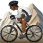 Person Mountain Biking: Medium-Dark Skin Tone