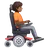 Person In Motorized Wheelchair Facing Right: Medium-Dark Skin Tone