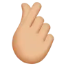 Hand With Index Finger And Thumb Crossed: Medium-Light Skin Tone Emoji 🫰🏼 image - Apple style